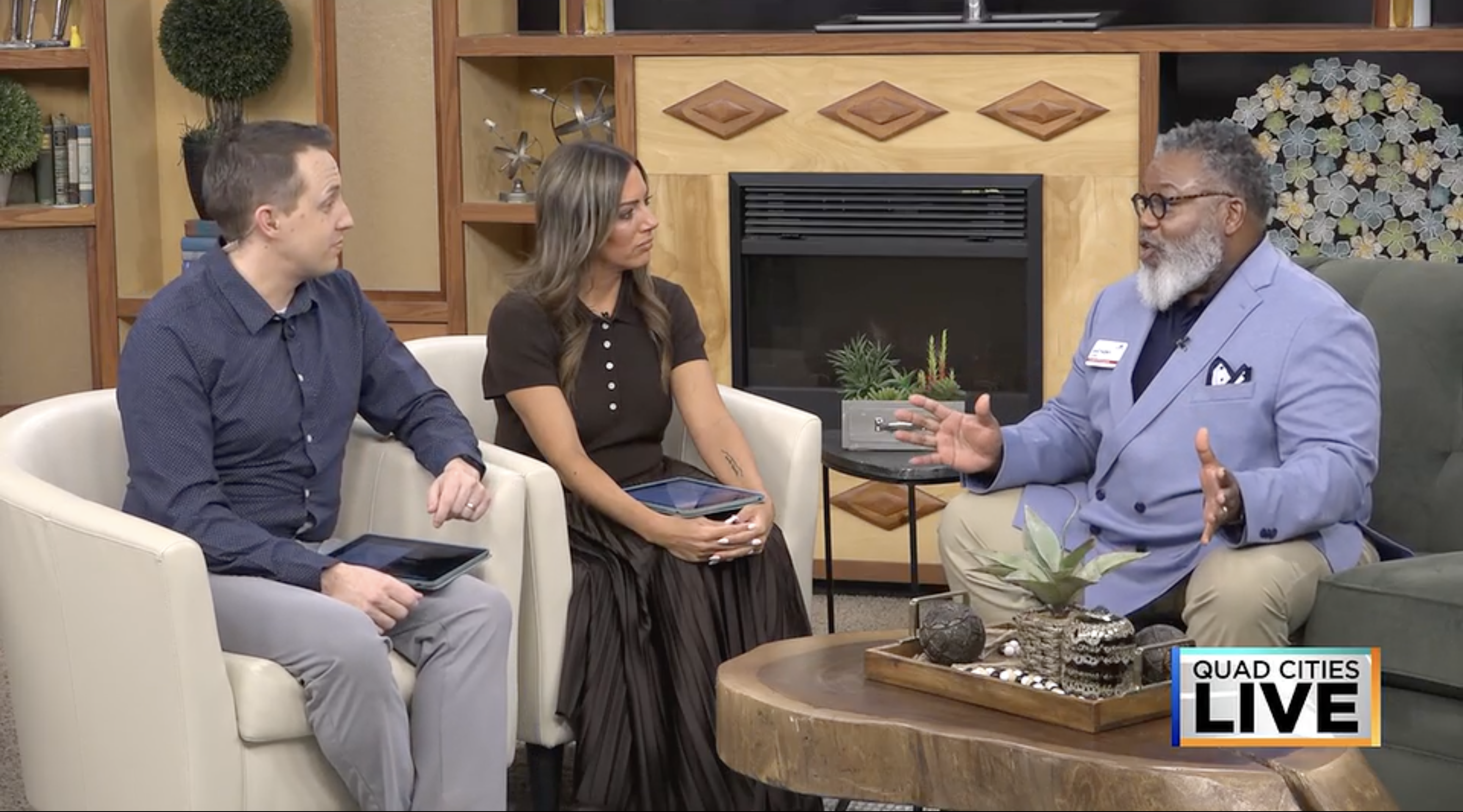 Anthony Law in KWQC studio with two TV hosts.