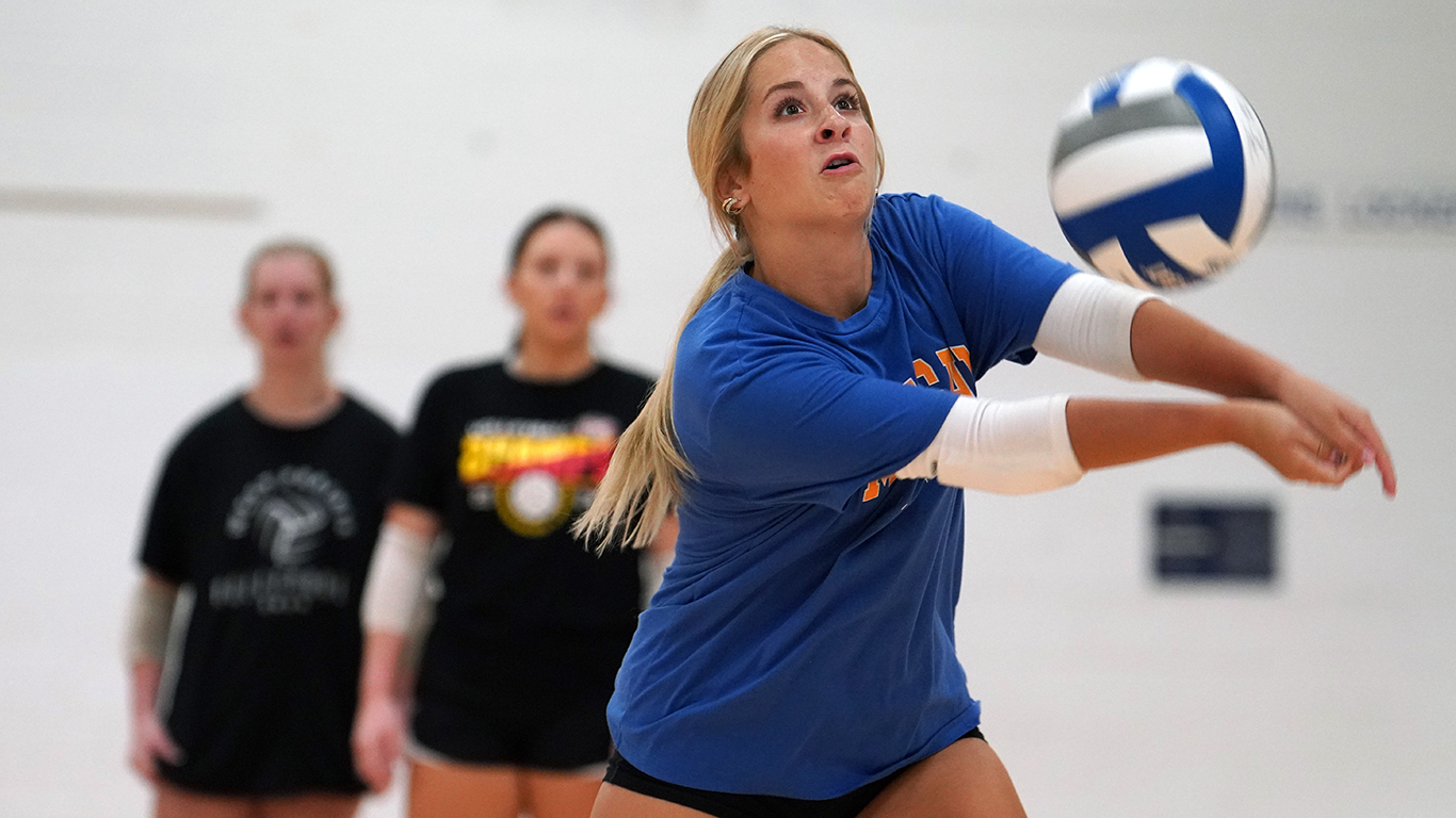 Volleyball player making dig at practice