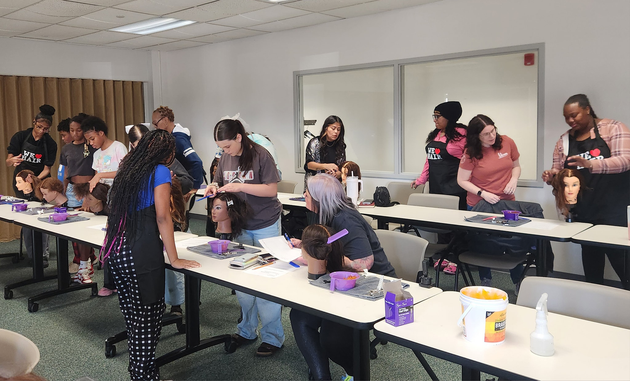 Participants at hair braiding workshop