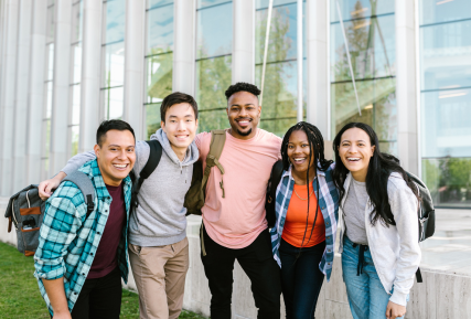 Group of diverse students outside smiling together