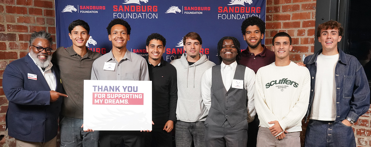 group of students smiling at camera.
