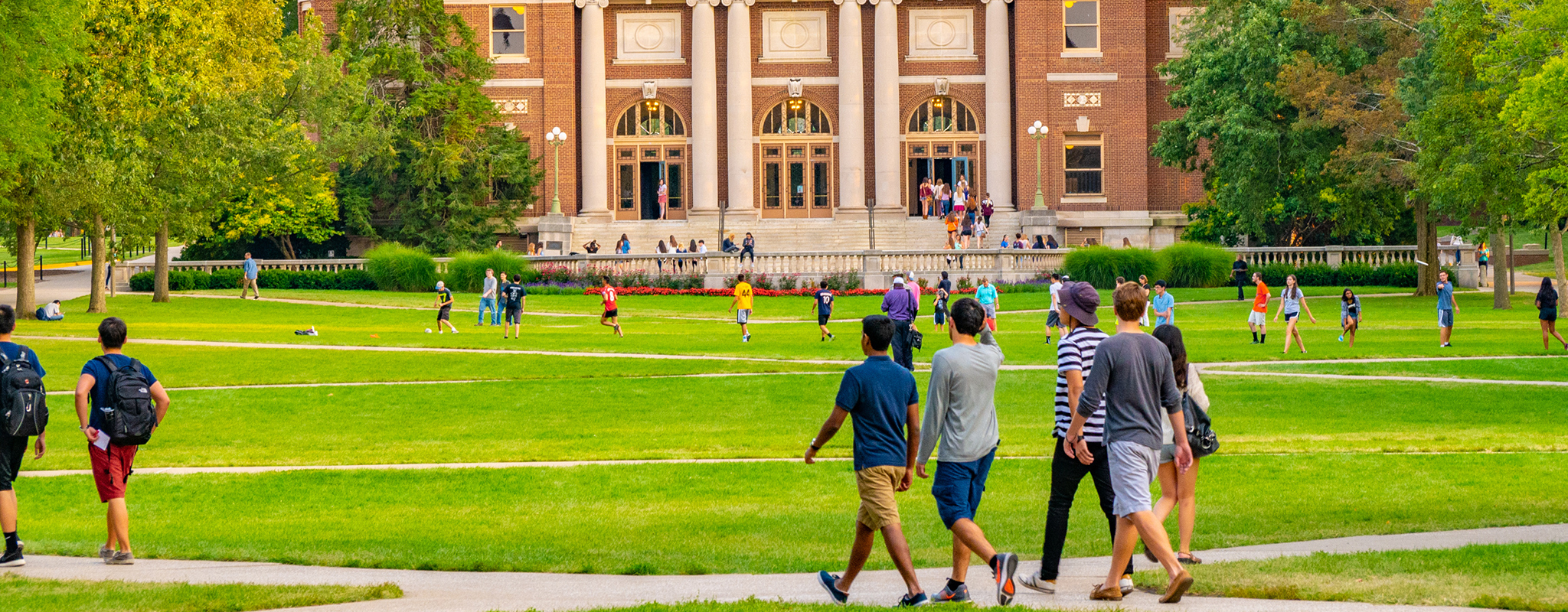 students walking on a campus quad.