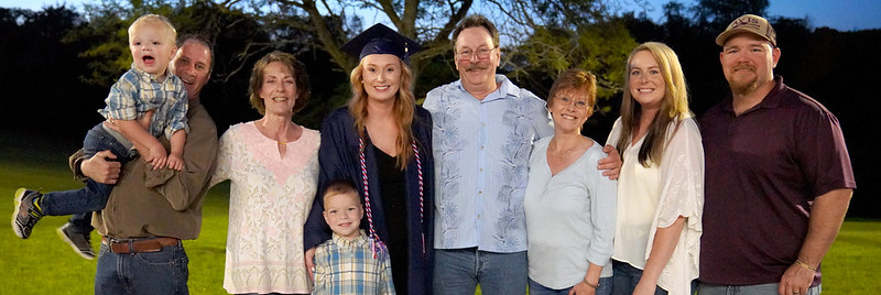 a family with the student at graduation.