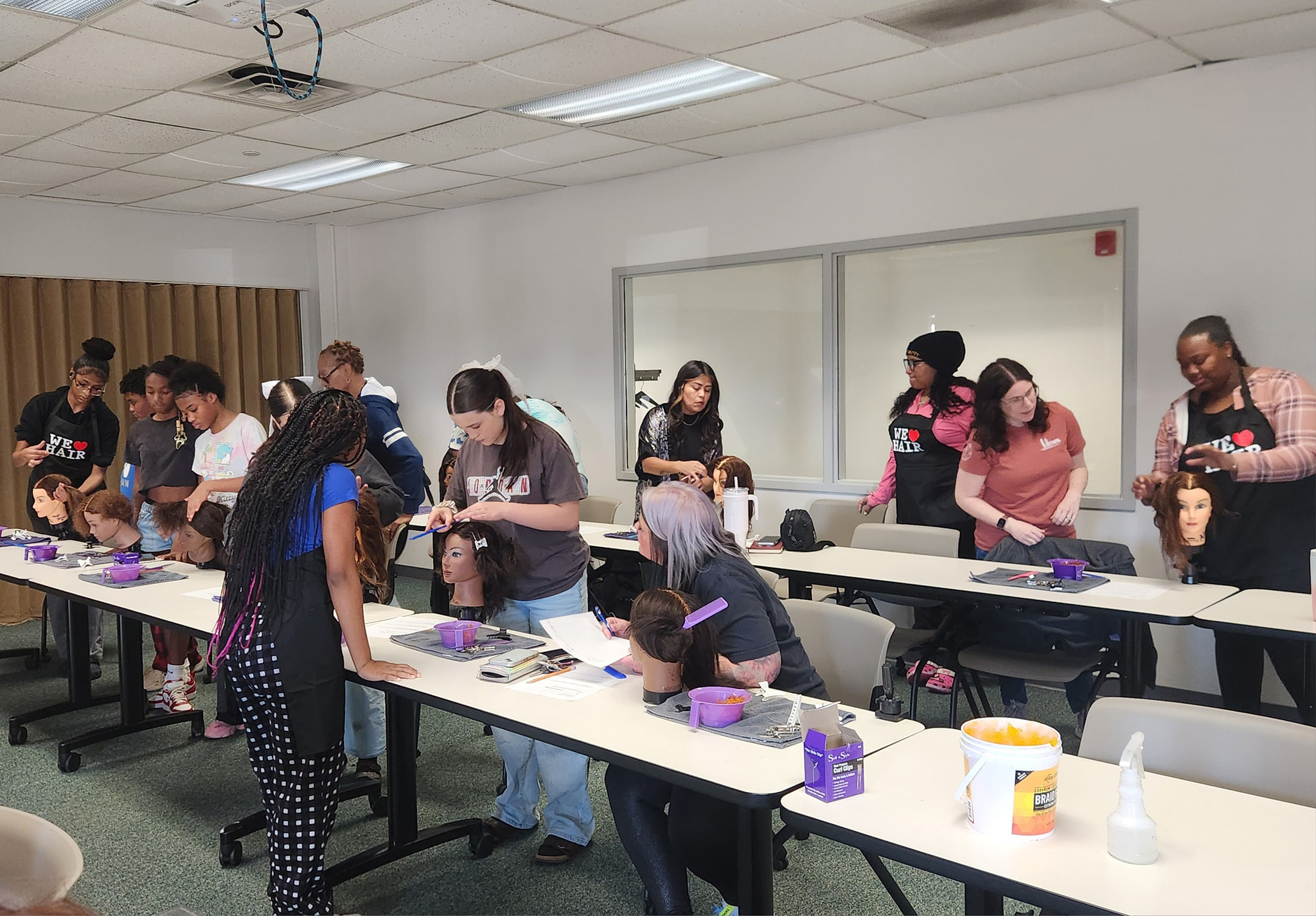 Participants at hair braiding workshop