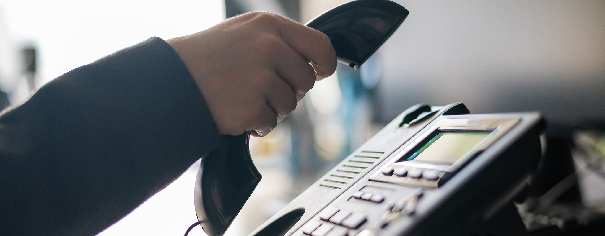 person hanging up a phone.