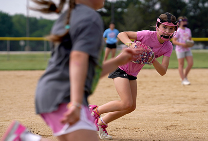 Kids playing softball.