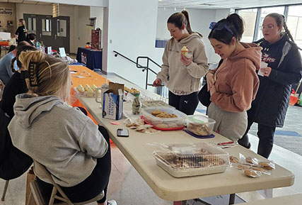 students talking around a table.