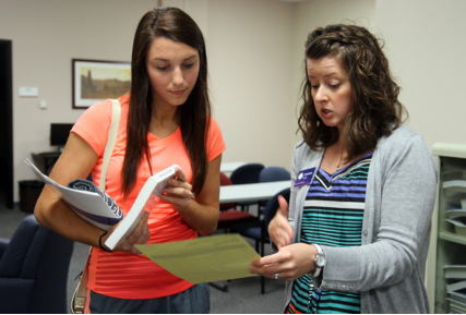 A Sandburg student talking to a woman